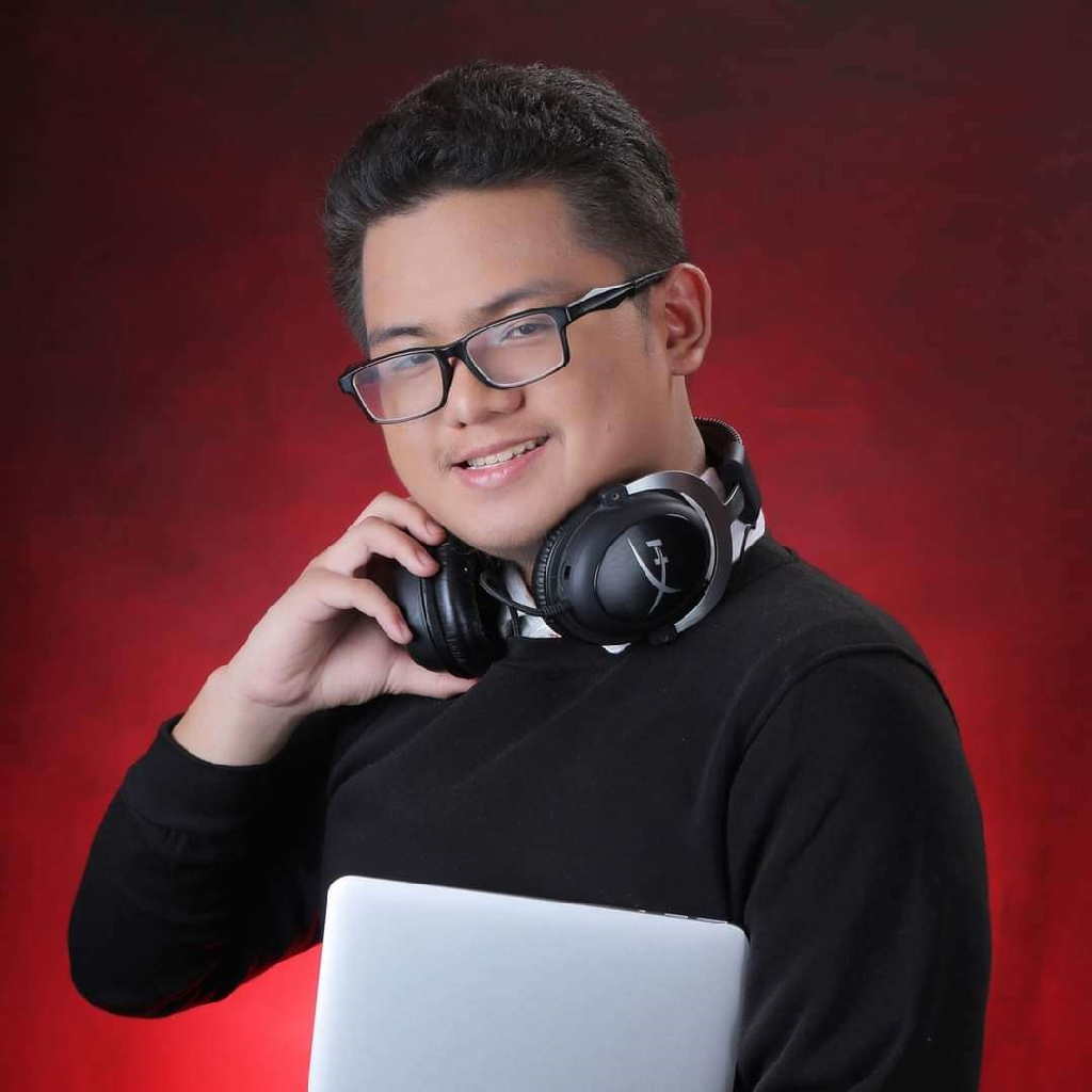 picture of Ellis Caluag with headphones against a red backdrop